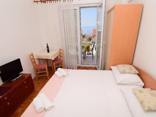 Ένα ή περισσότερα κρεβάτια σε δωμάτιο στο Apartments Ivan