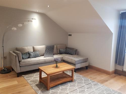 a living room with a couch and a coffee table at Ash in Burgh le Marsh