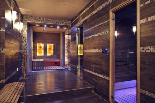 a hallway with wood paneled walls and a wooden floor at TIHANY (BALATON), BEST VIEW, SPACIOUS WELLNESS, CENTRAL , 50m BEACH in Tihany