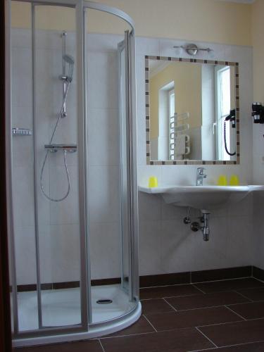 a bathroom with a shower and a sink at Pension Oberhorner in Schladming