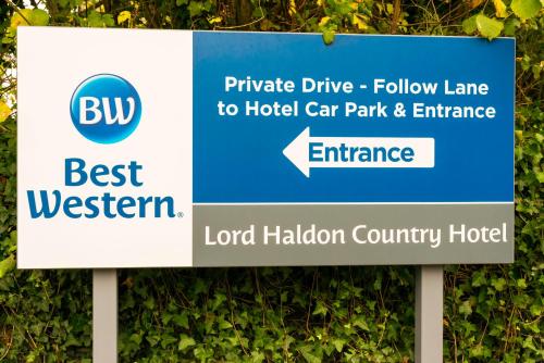 a sign for a hotel car park and entrance at Lord Haldon Country Hotel, Sure Hotel Collection by Best Western in Exeter