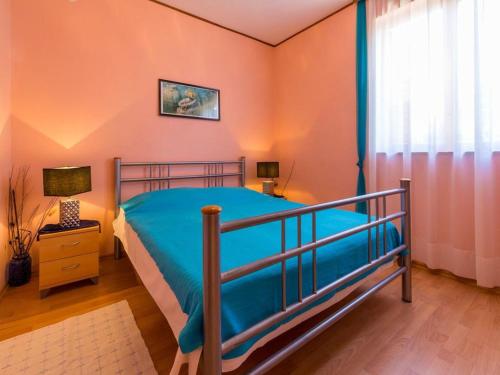 Кровать или кровати в номере Apartment Snjezana