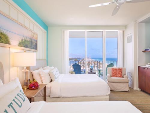 a bedroom with two beds and a view of the ocean at Margaritaville Hollywood Beach Resort in Hollywood