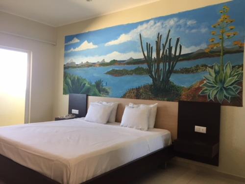 Kama o mga kama sa kuwarto sa Curacao Airport Hotel