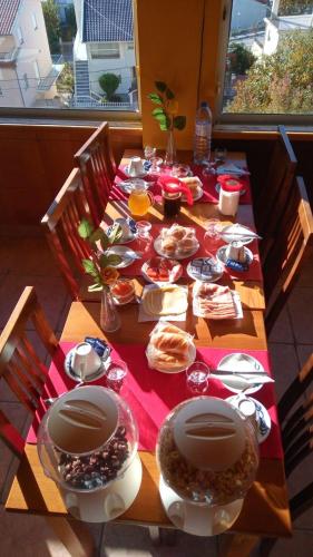 a wooden table with food on top of it at SEIA Apartamentos Serra da Estrela in Seia