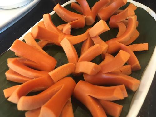 a bunch of orange carrots on a plate at Rapeepan Ville Hotel in Ubon Ratchathani
