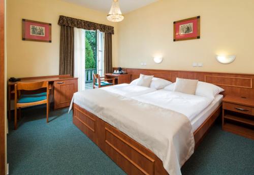 Postel nebo postele na pokoji v ubytování Spa Resort Libverda - Hotel Panorama