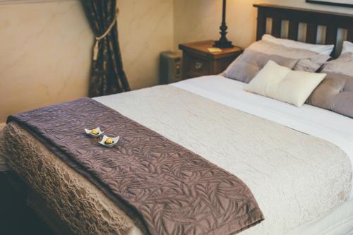 En eller flere senge i et værelse på Lexington Park Cottages