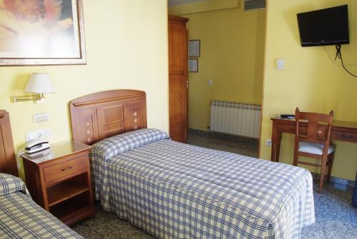 Postel nebo postele na pokoji v ubytování Hotel Restaurante Los Angeles