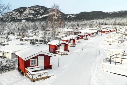 a row of houses covered in snow at First Camp Gol Hallingdal in Gol