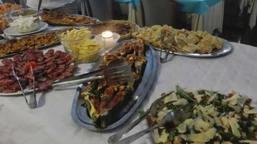 a table with many different types of food on it at Hotel Milanesina in Alassio