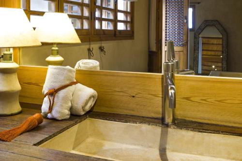 a teddy bear sitting on a counter in front of a mirror at Riad Chbanate in Essaouira