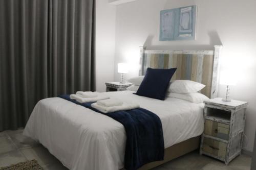 Postel nebo postele na pokoji v ubytování 109 da Gama on Beach