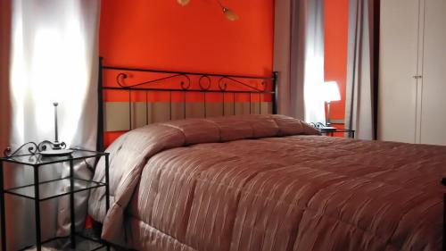 Un pat sau paturi într-o cameră la Villa Lorenzo