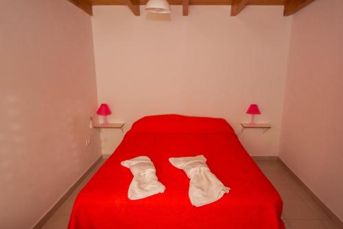 Ένα ή περισσότερα κρεβάτια σε δωμάτιο στο Maliva Cabanas