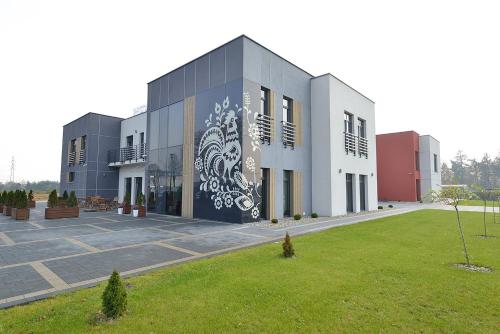 a building with a mural on the side of it at Nova Stodola in Kłomnice