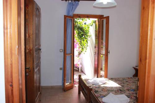 Posteľ alebo postele v izbe v ubytovaní Tasos Cottages
