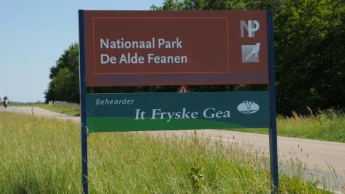 a sign on the side of a road at Hotel Princenhof in Earnewâld