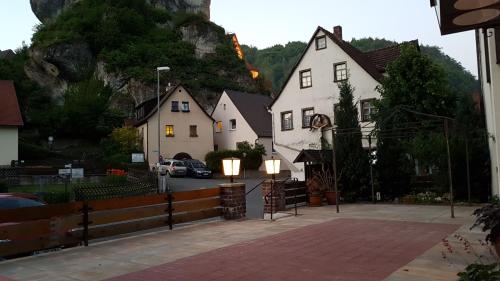 a group of houses with lights in a town at Pension-Puttlachtal in Pottenstein