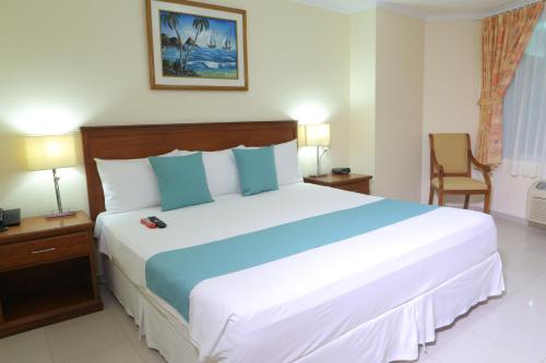 Ένα ή περισσότερα κρεβάτια σε δωμάτιο στο Hotel El Marqués