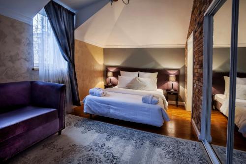 Кровать или кровати в номере Резиденция Булгакова