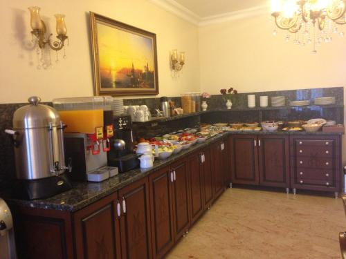 a kitchen with a counter with food on it at Sultan Palace Hotel in Istanbul