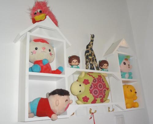 a white shelf with stuffed toys on it at Mahkota Cheras Sweet Condo 1-14 pax near MRT to KL in Kuala Lumpur