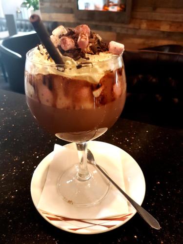 a dessert in a glass on a table at The Fairburn Hotel in Mauchline