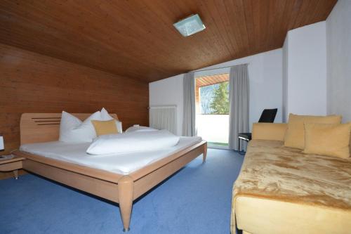 Ένα ή περισσότερα κρεβάτια σε δωμάτιο στο Haus Triumph