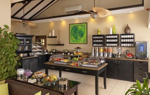 a kitchen with a buffet of food on display at Bucuti & Tara Boutique Beach Resort - Adult Only in Palm-Eagle Beach
