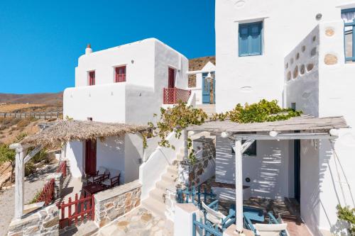 a white house with a view of the ocean at Kalderimi Traditional Houses in Astypalaia
