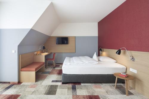 Hotel Schwanen tesisinde bir odada yatak veya yataklar