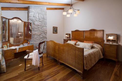 a bedroom with a large bed and a sink at Villa Primela**** in Labin