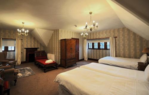 מיטה או מיטות בחדר ב-St Michaels Guest House