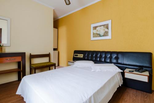 Ein Bett oder Betten in einem Zimmer der Unterkunft Hotel Acacia