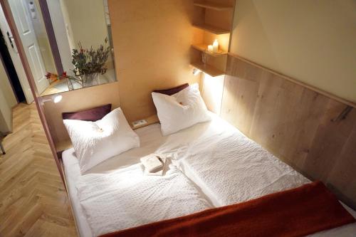 Postel nebo postele na pokoji v ubytování WANZ'inn Design Appartements