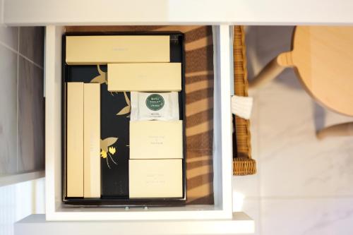 a stack of boxes in a display case at Luxury Condo Shikine An Gion Shirakawa in Kyoto