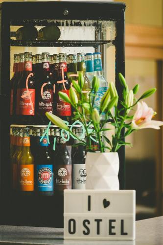 a refrigerator filled with lots of bottles of beer at Ostel Jugendhotel Bremervörde in Bremervörde