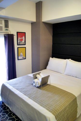 Postel nebo postele na pokoji v ubytování Saint Croix at Tagaytay Prime Residences