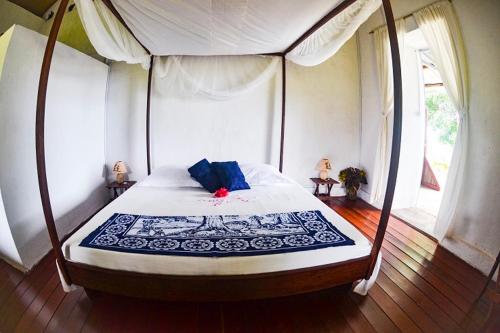 מיטה או מיטות בחדר ב-Lambawany