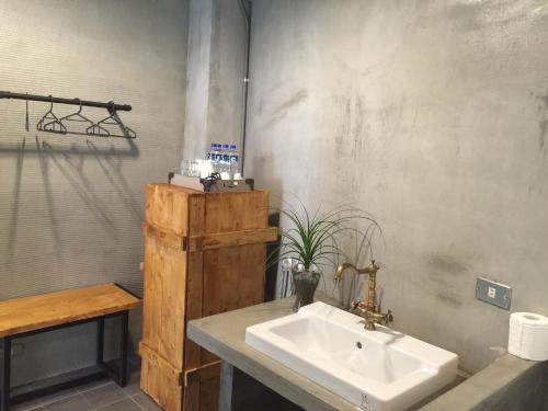 a bathroom with a sink and a counter with a sink at it's Apt. in Tainan
