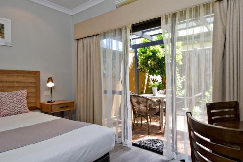 Ένα ή περισσότερα κρεβάτια σε δωμάτιο στο Vintages Accommodation