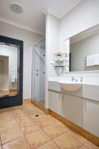 a bathroom with a sink and a mirror at Vintages Accommodation in Margaret River Town
