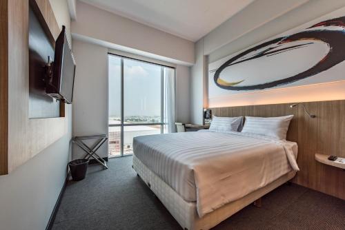 Tempat tidur dalam kamar di Enso Hotel