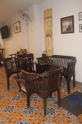 a group of chairs in a room at Ming Shou Boutique House in Phuket Town