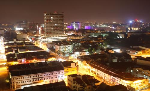 a view of a city at night with lights at H2H - Reunion House @ Majestic Ipoh 家好月圆 in Ipoh