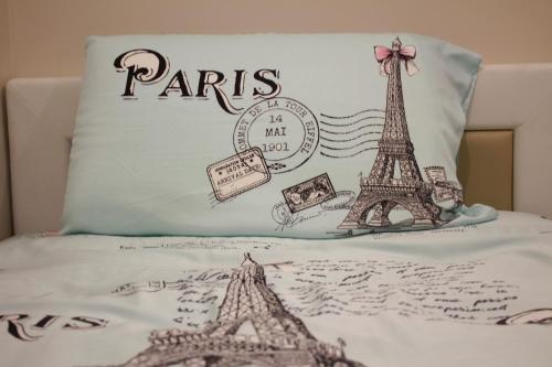 a pillow with the words paris and the eiffel tower at H2H - Reunion House @ Majestic Ipoh 家好月圆 in Ipoh