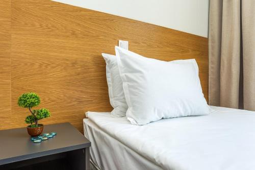 Ένα ή περισσότερα κρεβάτια σε δωμάτιο στο Park Hotel Asarel