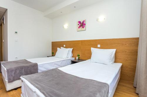 Ένα ή περισσότερα κρεβάτια σε δωμάτιο στο Park Hotel Asarel