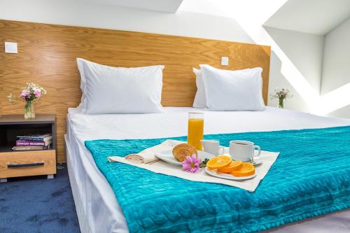 Ένα ή περισσότερα κρεβάτια σε δωμάτιο στο Park Hotel Asarel